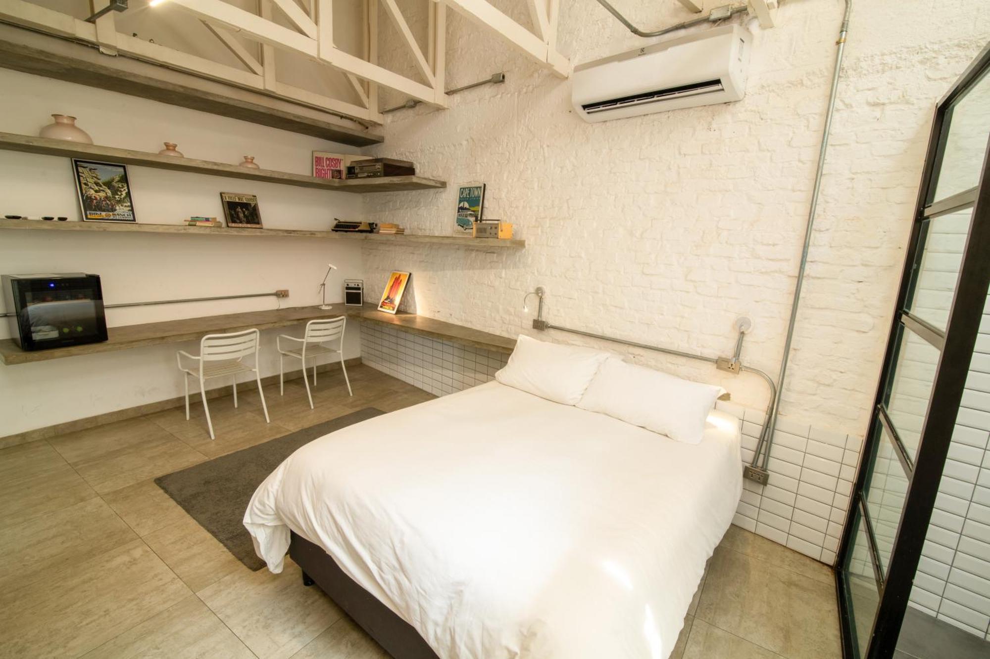 Cosmopolitano Hotel Boutique 산타 크루즈 드 라 시에라 외부 사진 A bedroom in a micro apartment